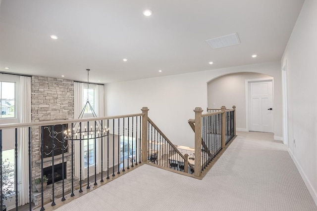 9016 Nestling Ridge Ct, College Grove, TN 37046 - corridor featuring an upstairs landing, carpet flooring, recessed lighting, arched walkways, and baseboards