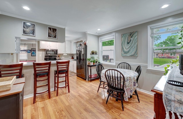 110 Marita Ave, Goodlettsville, TN 37072 - dining space featuring crown molding, light wood-type flooring, and recessed lighting