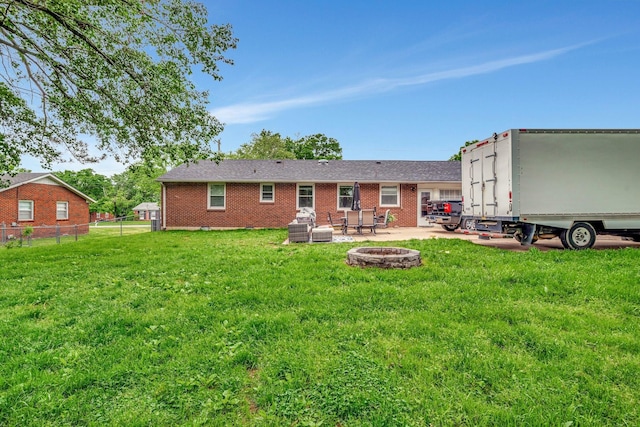 110 Marita Ave, Goodlettsville, TN 37072 - back of house with a fire pit, a patio, and brick siding