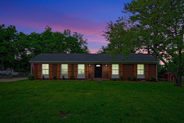 110 Marita Ave, Goodlettsville, TN 37072 - ranch-style house with a lawn, brick siding, a storage shed, and an outdoor structure