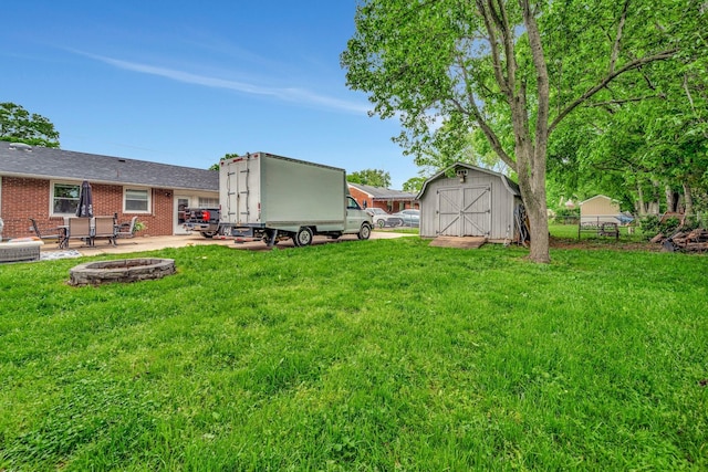 110 Marita Ave, Goodlettsville, TN 37072 - view of yard with a storage unit, an outdoor fire pit, a patio, and an outdoor structure