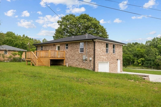 1024 Evans Rd, Burns, TN 37029 - rear view of property with a garage, concrete driveway, a wooden deck, a lawn, and stairs