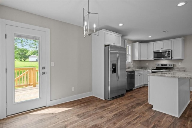 1024 Evans Rd, Burns, TN 37029 - kitchen featuring stainless steel appliances, a sink, white cabinets, recessed lighting, and dark wood-type flooring