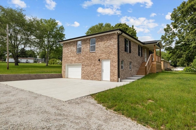 1024 Evans Rd, Burns, TN 37029 - view of side of property with concrete driveway, a garage, stairs, and a yard