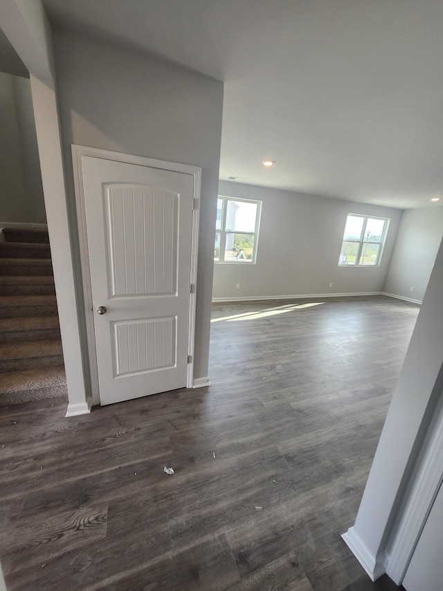 spare room with baseboards, plenty of natural light, stairs, and recessed lighting