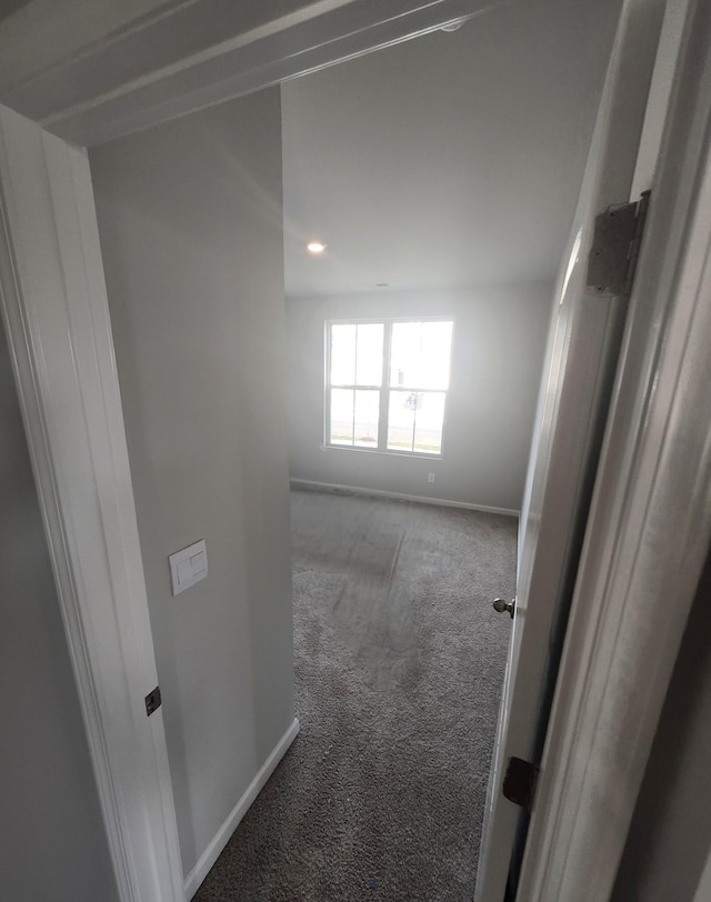 spare room with carpet floors, baseboards, and recessed lighting