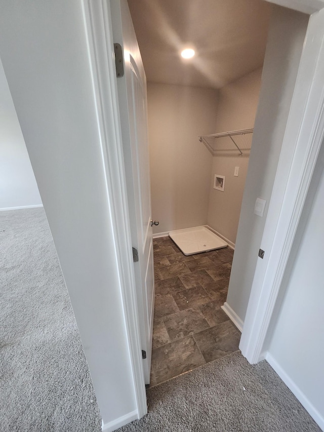 clothes washing area with carpet flooring, hookup for a washing machine, stone finish flooring, and baseboards