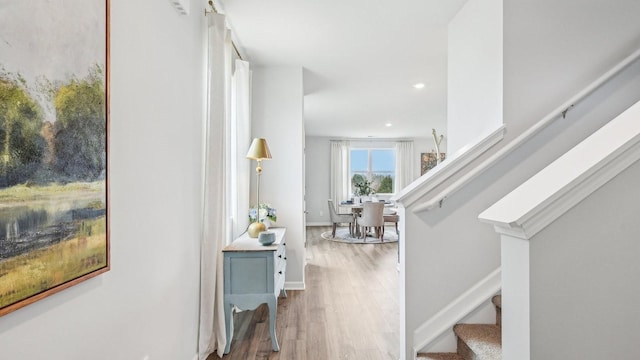 foyer entrance featuring stairway, wood finished floors, recessed lighting, and baseboards