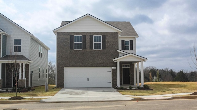 traditional home with an attached garage, brick siding, and concrete driveway