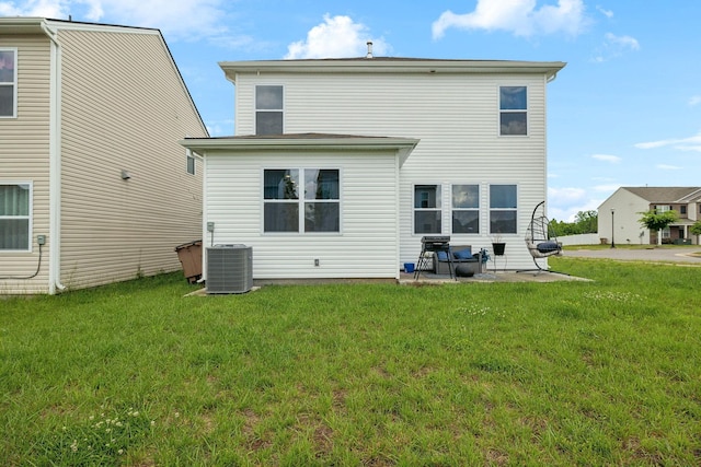7401 Brady Ln, Antioch, TN 37013 - back of property with cooling unit, a yard, and a patio area