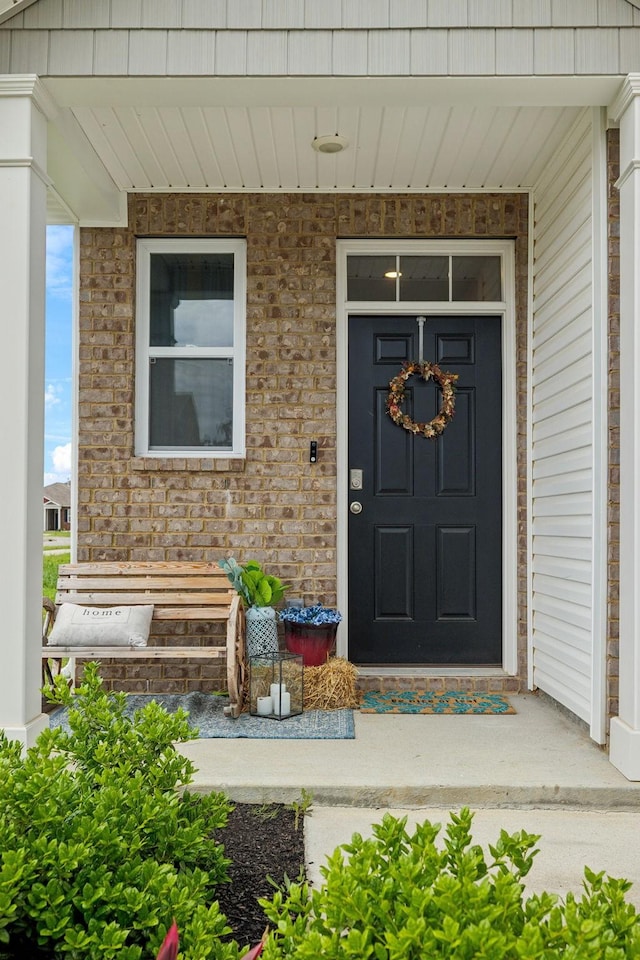 7401 Brady Ln, Antioch, TN 37013 - doorway to property with covered porch and brick siding