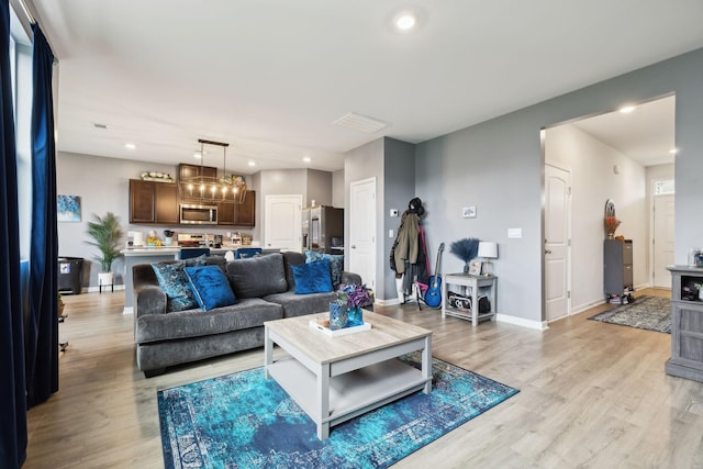7401 Brady Ln, Antioch, TN 37013 - living room with light wood-style flooring, recessed lighting, and baseboards