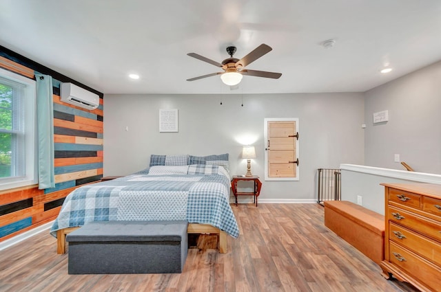 517 Main St, Burns, TN 37029 - bedroom with a wall mounted AC, recessed lighting, wood finished floors, baseboards, and a ceiling fan