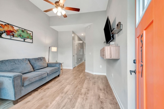 517 Main St, Burns, TN 37029 - living area with a ceiling fan, light wood finished floors, and baseboards