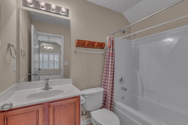 bathroom featuring toilet, vanity, shower / bath combo with shower curtain, lofted ceiling, and a textured ceiling
