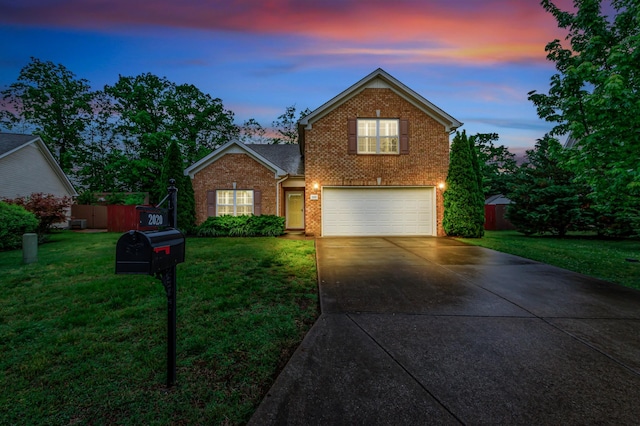 traditional-style house featuring brick siding, driveway, and an attached garage