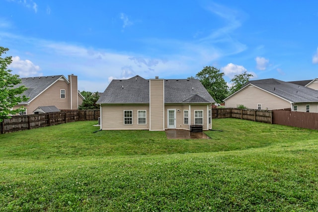 back of property with a patio area and a chimney