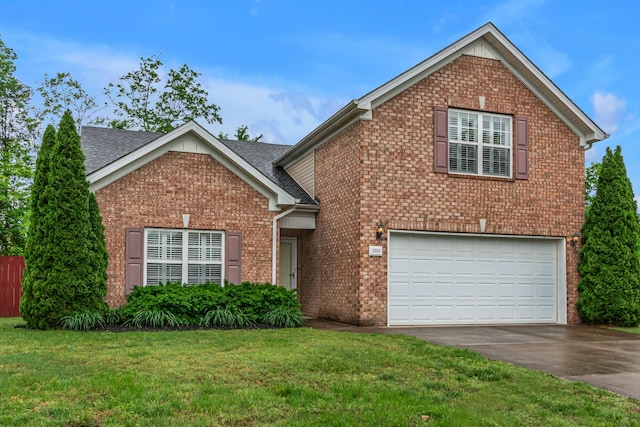 traditional-style home featuring a garage, brick siding, asphalt driveway, a front yard, and a shingled roof