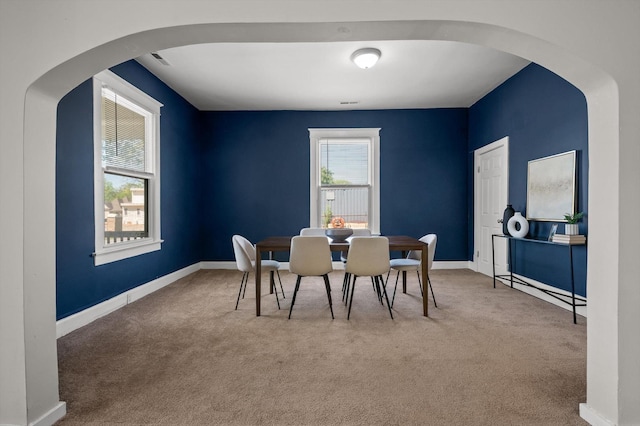 2001 E 16th St, Chattanooga, TN 37404 - carpeted dining area featuring arched walkways and baseboards