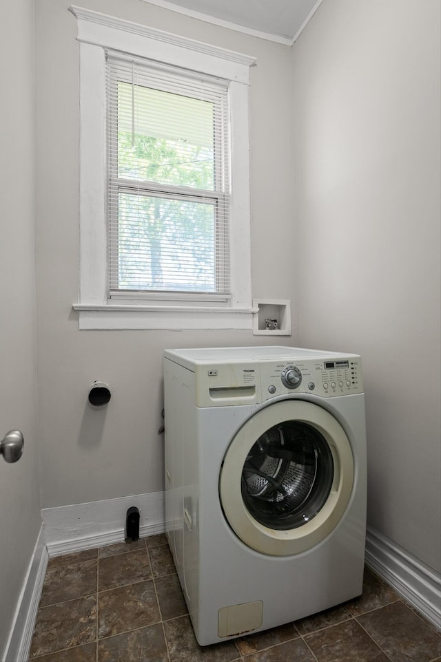 2001 E 16th St, Chattanooga, TN 37404 - laundry area featuring washer / dryer, ornamental molding, and dark stone finish flooring