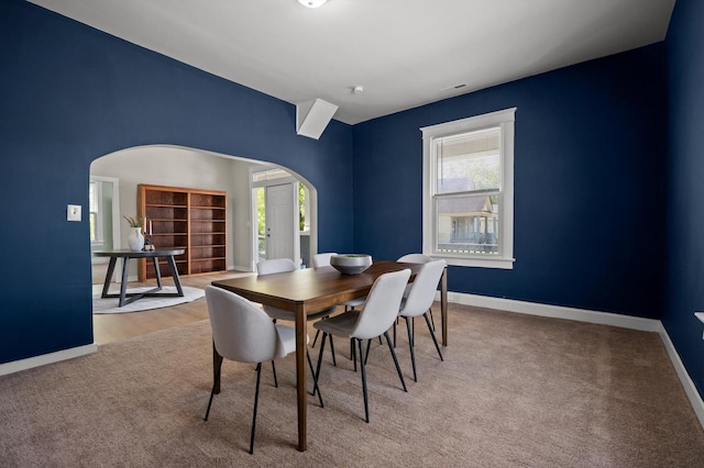 2001 E 16th St, Chattanooga, TN 37404 - dining room featuring arched walkways, plenty of natural light, and carpet