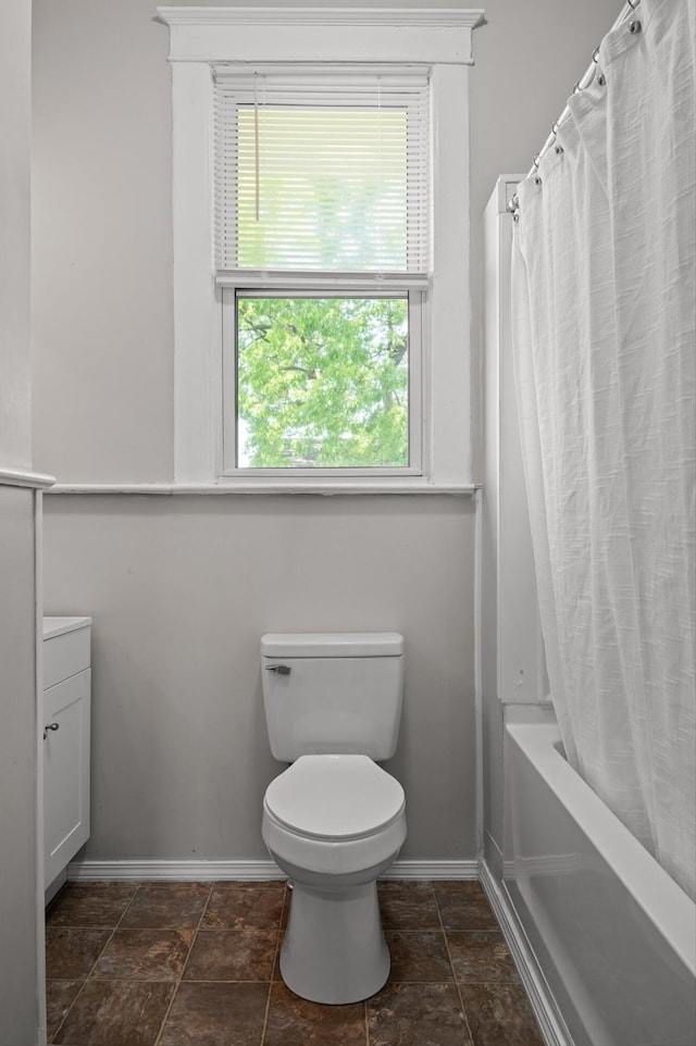 2001 E 16th St, Chattanooga, TN 37404 - bathroom with vanity, shower / bath combination with curtain, and stone finish floors