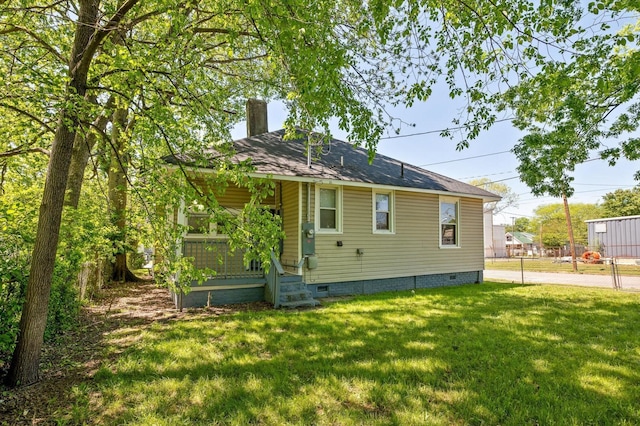 2001 E 16th St, Chattanooga, TN 37404 - back of property featuring crawl space, a chimney, a yard, and roof with shingles
