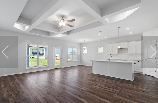 6152 Worthingtion, Columbia, TN 38401 - unfurnished living room featuring coffered ceiling, recessed lighting, dark wood-style floors, baseboards, and ceiling fan
