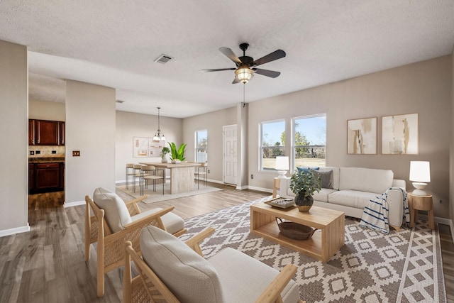 107 Owl Dr, Lebanon, TN 37087 - living room with light wood-style floors, a ceiling fan, and baseboards