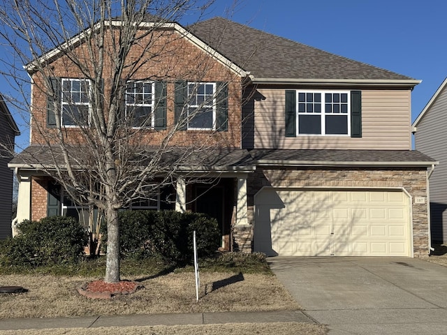 107 Owl Dr, Lebanon, TN 37087 - view of front of house with an attached garage, concrete driveway, and roof with shingles