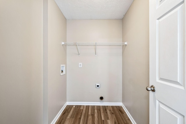 107 Owl Dr, Lebanon, TN 37087 - washroom featuring hookup for an electric dryer, dark wood finished floors, hookup for a washing machine, baseboards, and a textured ceiling