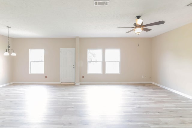 107 Owl Dr, Lebanon, TN 37087 - spare room with light wood finished floors, a ceiling fan, a chandelier, baseboards, and a textured ceiling