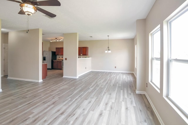 107 Owl Dr, Lebanon, TN 37087 - unfurnished living room featuring ceiling fan, light wood-style floors, and baseboards