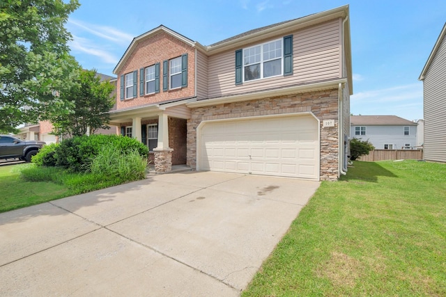 107 Owl Dr, Lebanon, TN 37087 - craftsman-style house with an attached garage, stone siding, a front yard, and concrete driveway