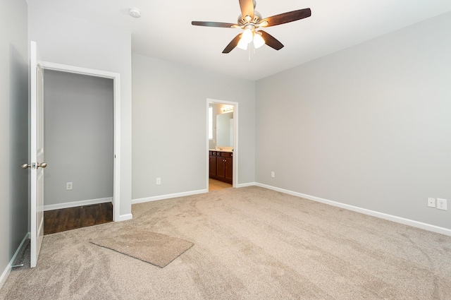8007 Timber Cove Dr, Mount Juliet, TN 37122 - unfurnished bedroom with light colored carpet, baseboards, ceiling fan, and ensuite bath