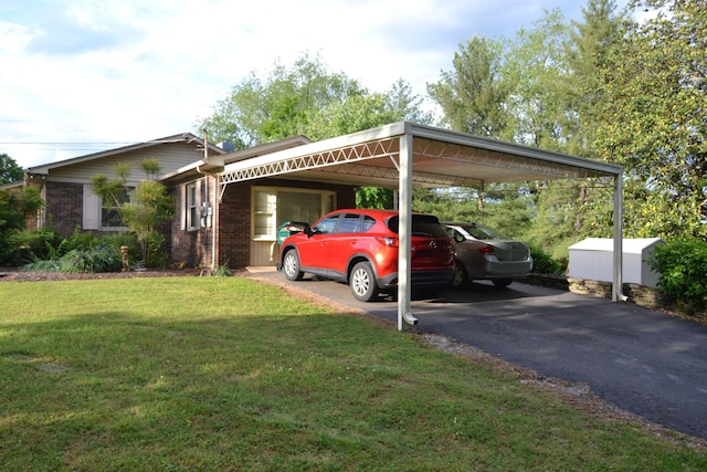 1210 Stewart Dr, Pulaski, TN 38478 - view of parking / parking lot featuring an attached carport and asphalt driveway