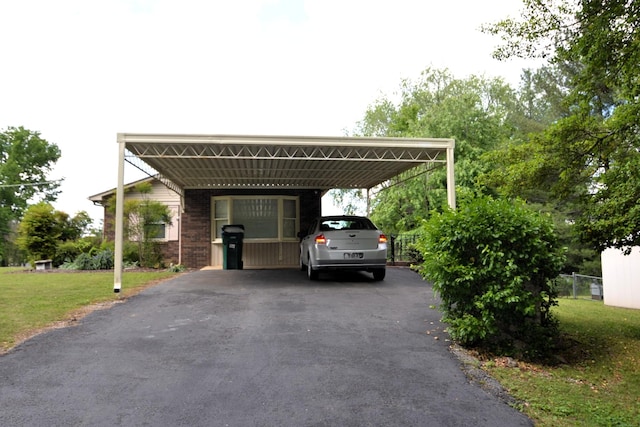 1210 Stewart Dr, Pulaski, TN 38478 - view of vehicle parking with asphalt driveway and a carport