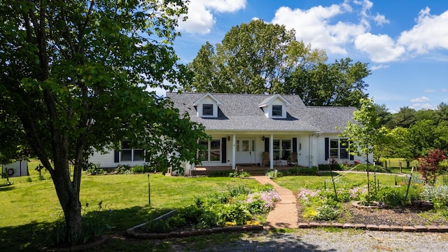 860 Dixie Bee Rd, Adams, TN 37010 - new england style home with a porch, a front yard, and a shingled roof