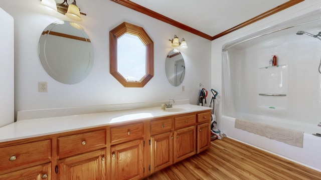 860 Dixie Bee Rd, Adams, TN 37010 - full bath featuring wood finished floors, vanity, ornamental molding, and shower / bathtub combination