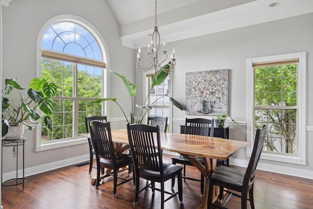dining area featuring a chandelier, vaulted ceiling, baseboards, and dark wood-style floors