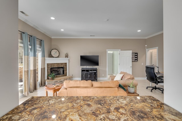 tiled living area featuring crown molding, a fireplace, recessed lighting, and baseboards