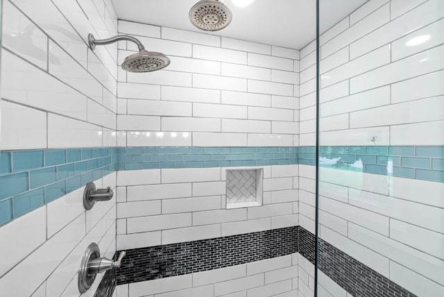 bathroom featuring tiled shower