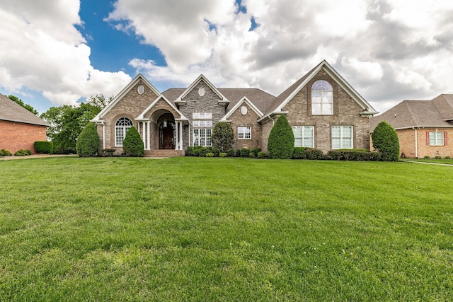 131 Grandview Cir, Gallatin, TN 37066 - traditional-style house featuring brick siding and a front lawn