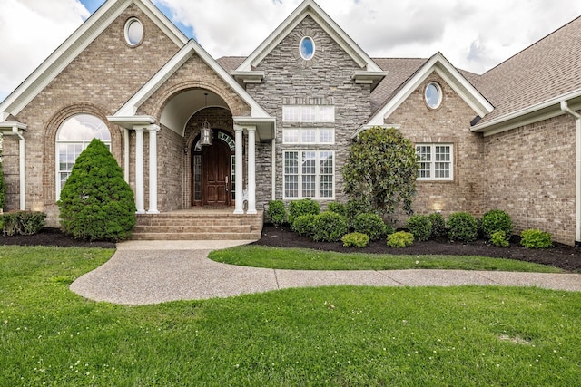 131 Grandview Cir, Gallatin, TN 37066 - view of front of property featuring brick siding, a front yard, and a shingled roof