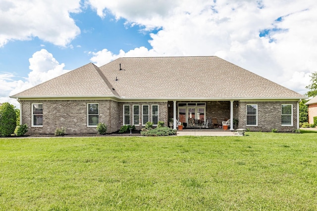 131 Grandview Cir, Gallatin, TN 37066 - back of property with a patio area, a lawn, brick siding, and a shingled roof