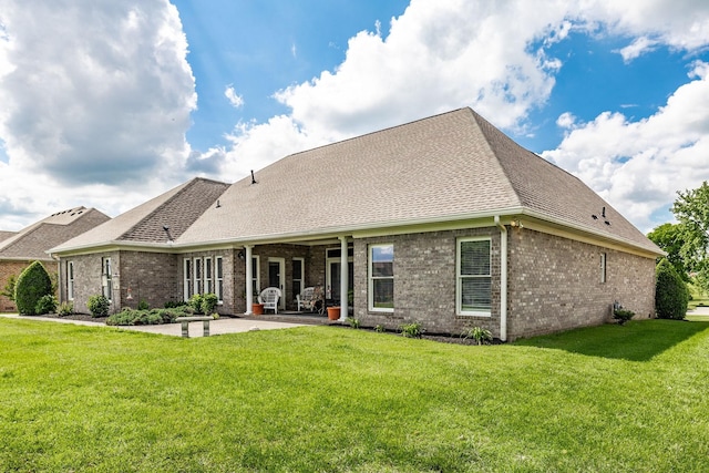 131 Grandview Cir, Gallatin, TN 37066 - back of house with a patio, brick siding, a lawn, and roof with shingles