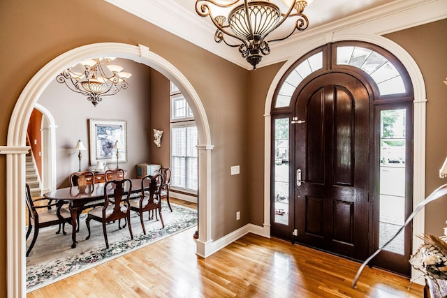 131 Grandview Cir, Gallatin, TN 37066 - foyer entrance featuring a chandelier, arched walkways, healthy amount of natural light, and ornamental molding