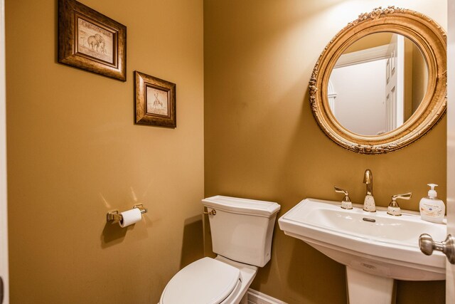 131 Grandview Cir, Gallatin, TN 37066 - half bathroom with toilet, baseboards, and a sink