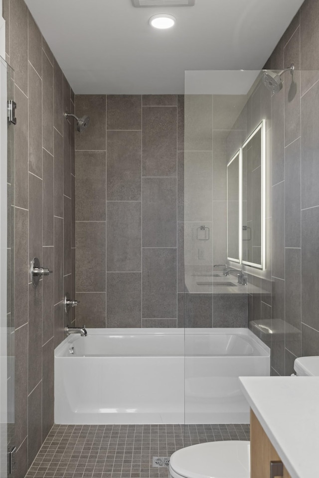 bathroom with vanity, toilet, and bathing tub / shower combination