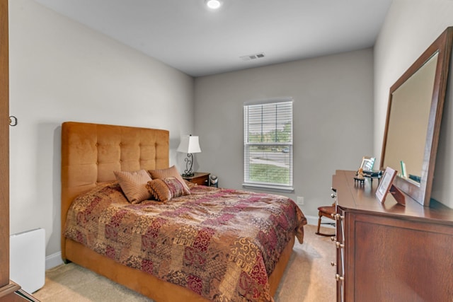 bedroom with carpet flooring and baseboards